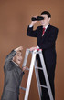 Businessmen on corporate ladder doing observation