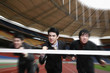 Businessmen running towards finish line