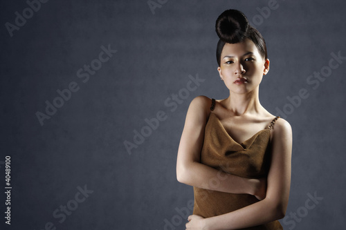 Photo: Woman posing in evening dress Woman posing in evening dress