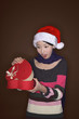 Foto: Woman opening present with her mouth opened Woman opening present with her mouth opened