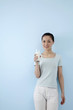 Photo: Woman holding a glass of milk Woman holding a glass of milk
