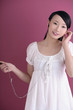 Foto: Woman listening to music on the portable MP3 player Woman listening to music on the portable MP3 player