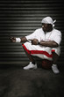Man sitting on basketball text messaging