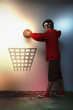 Man putting basketball into hoop symbol