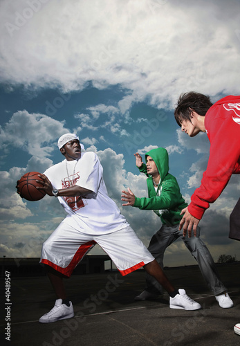 Photo: Men playing basketball Men playing basketball