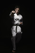Photo: Man performing karate move Man performing karate move