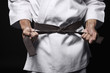 Man tightening his belt
