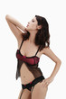 Woman in black and fuchsia sheer chemise