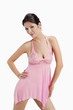 Woman in pink multi-fibre halter-neck chemise