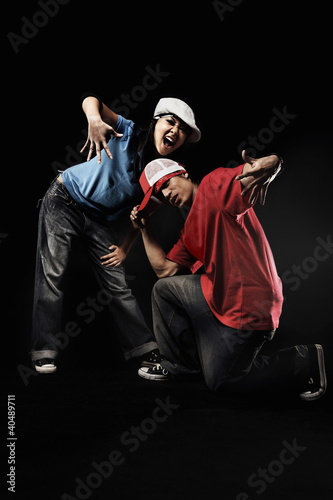 Photo: Young man and woman posing for the camera Young man and woman posing for the camera