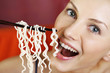 Photo: Woman eating instant noodle Woman eating instant noodle