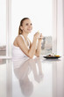 Photo: Woman smiling and holding a cup of lemon tea Woman smiling and holding a cup of lemon tea