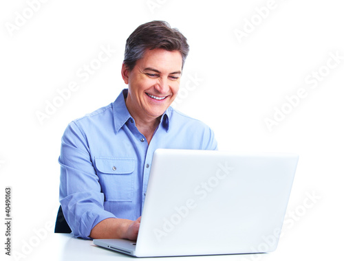 Photo: Handsome man with laptop computer. Handsome man with laptop computer.