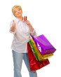 Happy senior woman with bags and credit card