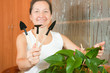 Woman takes care of indoor plants