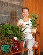 woman with flowers in the pot