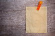 orange clip and recycle paper for write text on wood texture