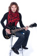 Seated man with a guitar on a white background Seated man with a guitar on a white background
