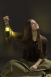 The girl with a lantern looks upwards