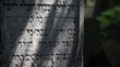 Close-up of Jewish tomb in changing sunlight