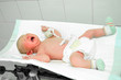 Weighing the newborn baby
