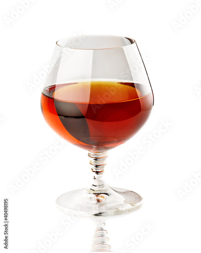 Photo: Glass of cognac isolated on white Glass of cognac isolated on white