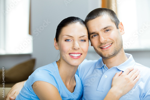 Photo: Young happy couple at home Young happy couple at home