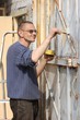 Man painting gate  Ukraine