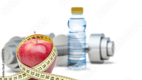Photo: Dumbbells with an apple and measuring type Dumbbells with an apple and measuring type