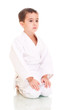 Karate boy sitting in white kimono Karate boy sitting in white kimono