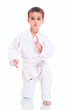 Aikido boy fighting position in white kimono Aikido boy fighting position in white kimono