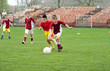 boy kicking ball