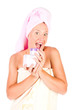 Beautiful woman tender jar of moisturizer cream.