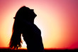 Woman relaxing at sunset Woman relaxing at sunset