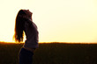 Woman relaxing at sunset Woman relaxing at sunset