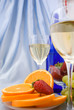 Clouseup of two glasses of wine with oranges and strawberry Clouseup of two glasses of wine with oranges and strawberry