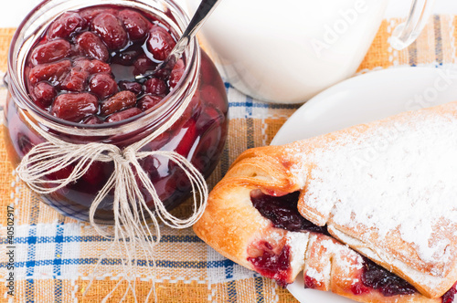 Photo: House jam and croissant with a cherry on a rasping napkin House jam and croissant with a cherry on a rasping napkin