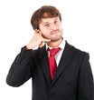 Businessman miming a phone with his hand Businessman miming a phone with his hand