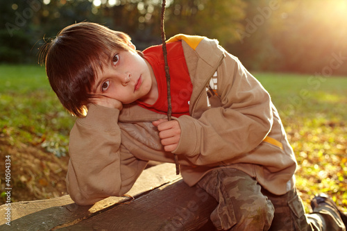 Photo: Boy in an autumn park Boy in an autumn park
