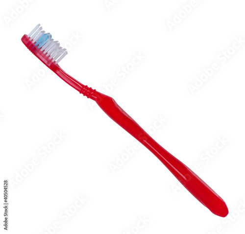 Photo: Toothbrush red color on white background. Toothbrush red color on white background.