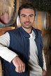 Man stood in wine cellar Man stood in wine cellar