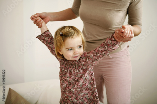 Photo: Girl playing with her mother Girl playing with her mother