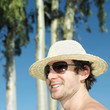 Man in straw hat and sunglasses