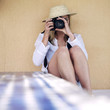 Professional female photographer taking picture