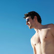 Bare chested man in sunglasses