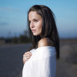 Woman waiting by the roadside
