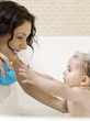 Photo : Mother bathing for baby girl Mother bathing for baby girl
