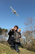 Father and son playing with an aeroplane
