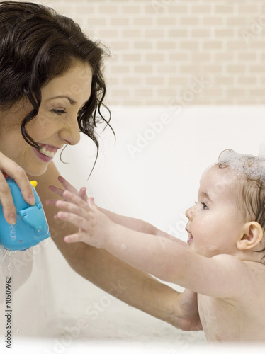Photo: Mother bathing for baby girl Mother bathing for baby girl
