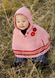 Girl in pink cape